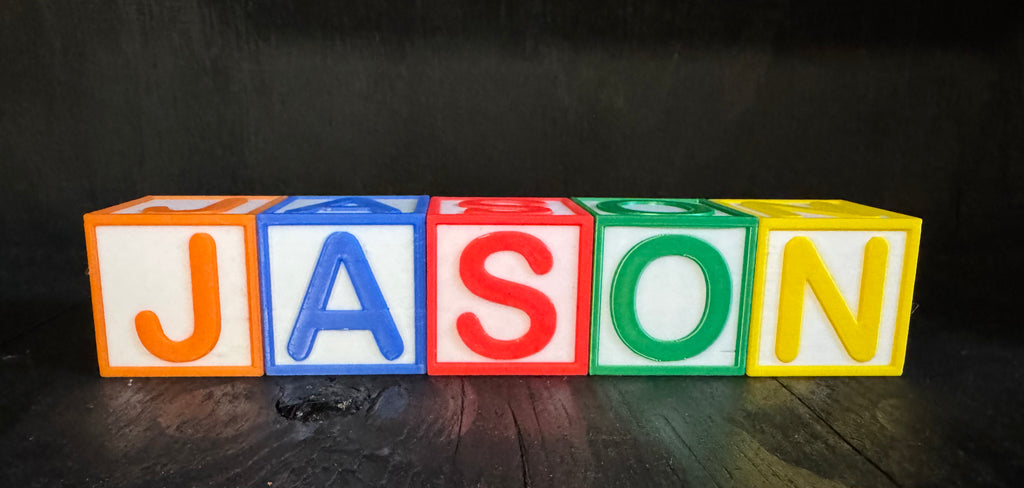 Custom letter blocks spelling JASON in a row - front view