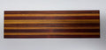 Striped hardwood cutting board with alternating purpleheart, oak, and walnut strips - top view