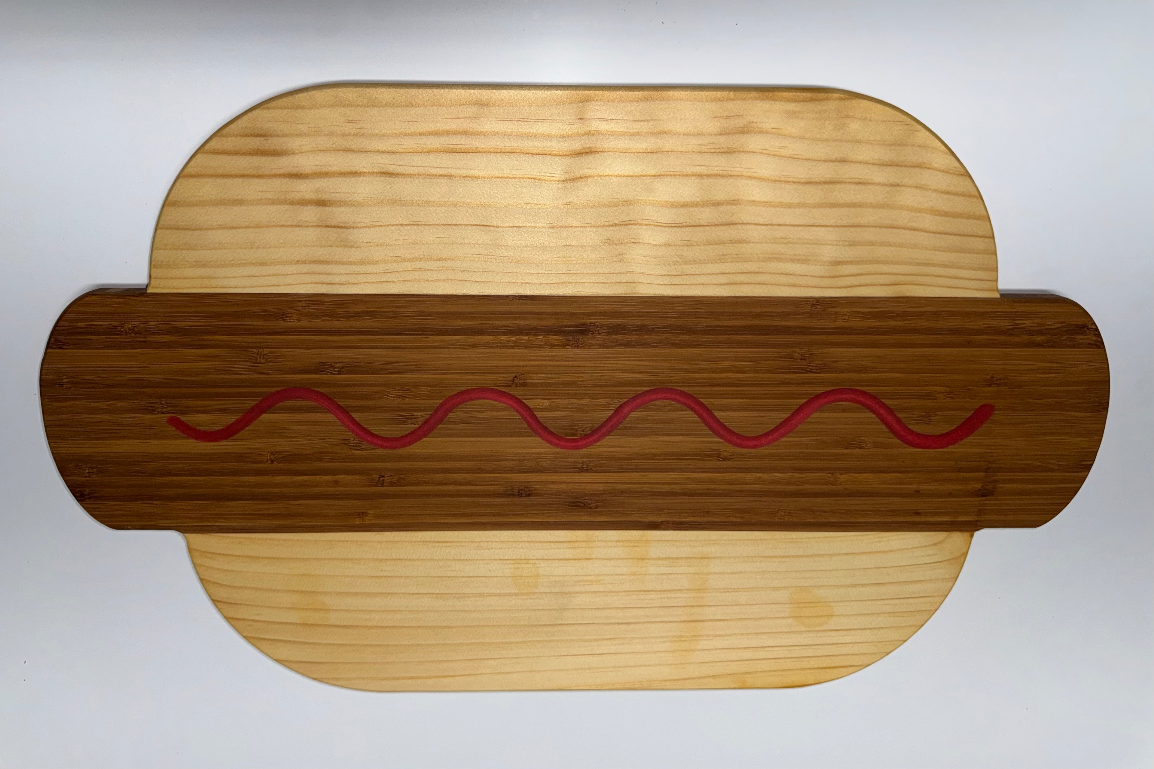 Hot dog shaped cutting board - bamboo with ketchup squiggle
