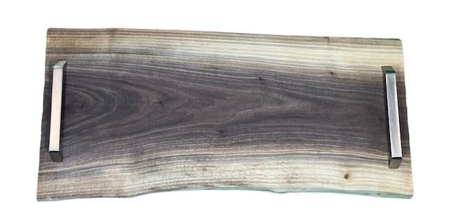 Live edge walnut serving tray with brushed metal handles, front view