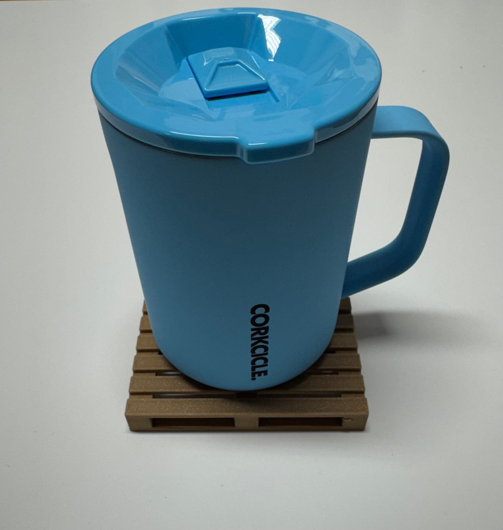 Blue Corkcicle mug sitting on a single mini pallet coaster
