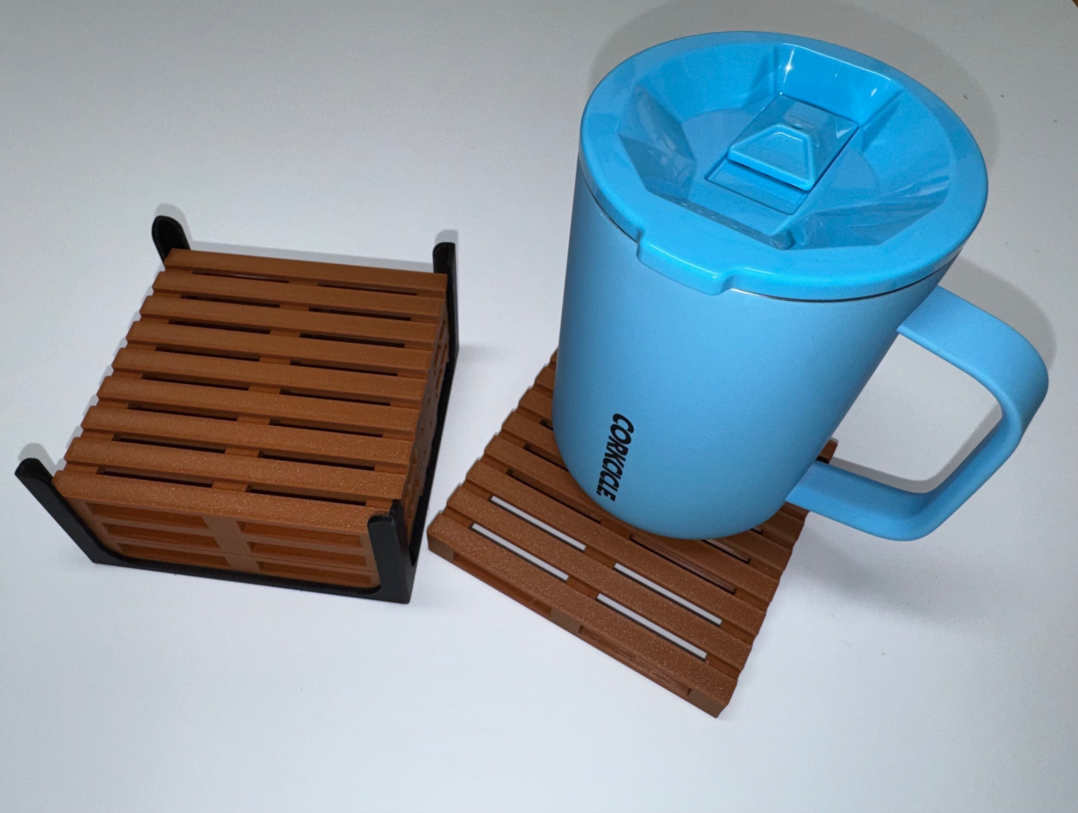 Mini pallet coaster set with holder next to blue Corkcicle mug