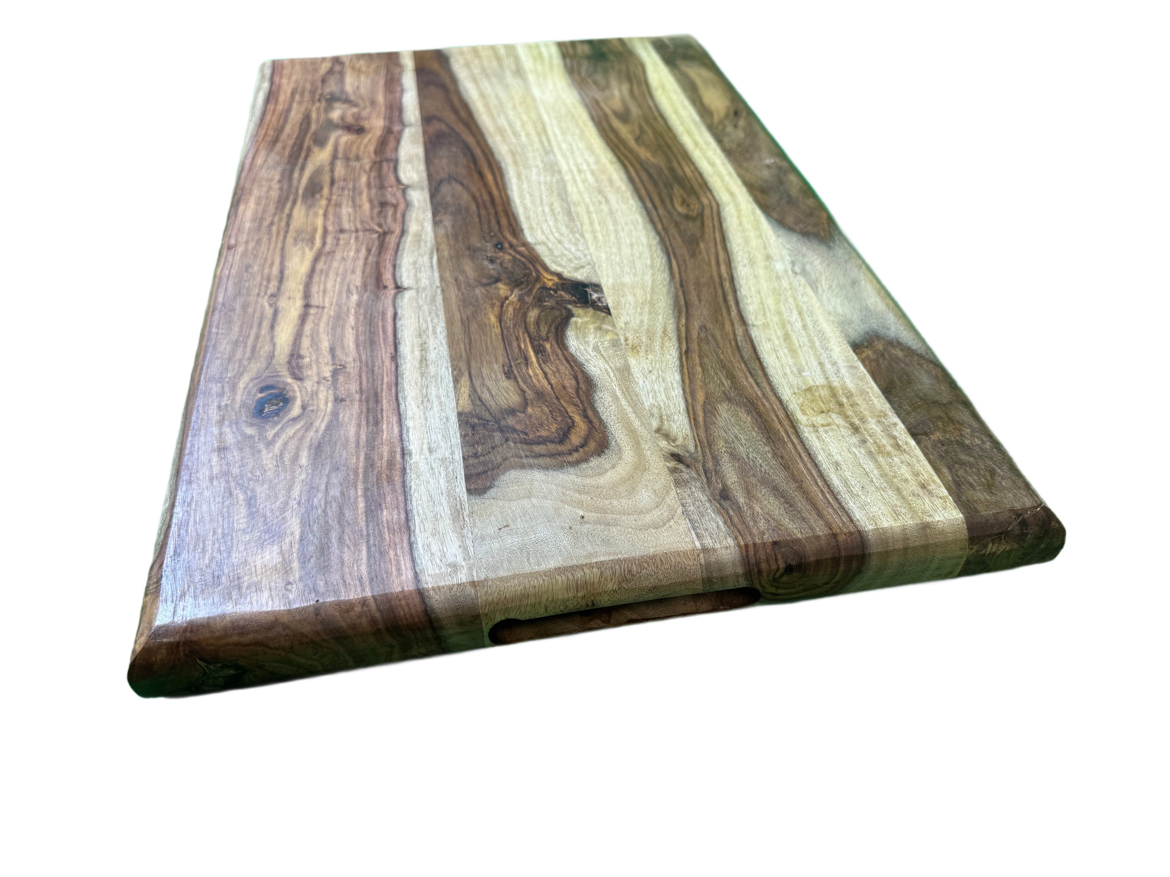 Walnut cutting board angled top view showing rich grain and knots