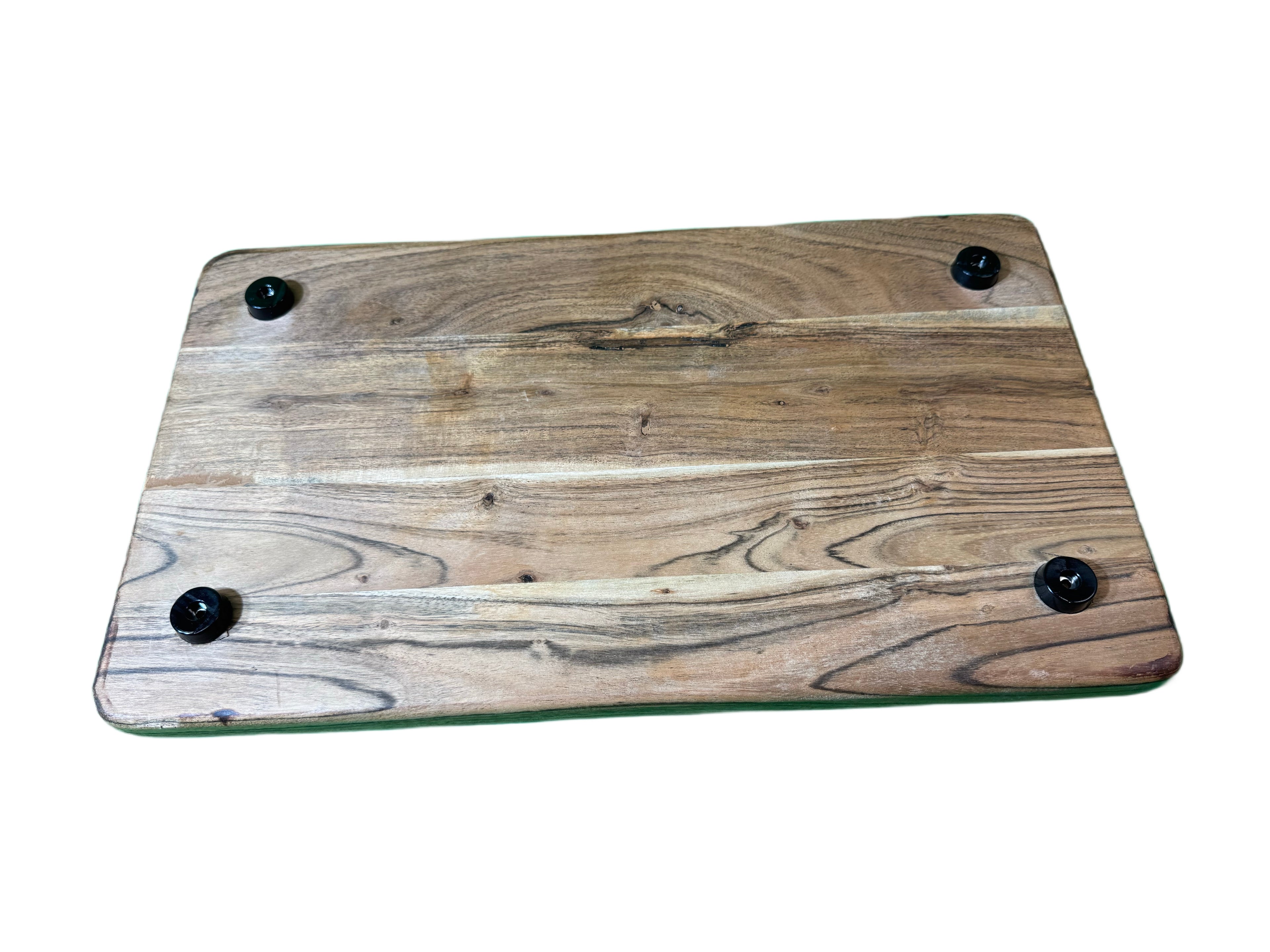 Bottom view of hardwood cutting board showing four non-slip rubber feet