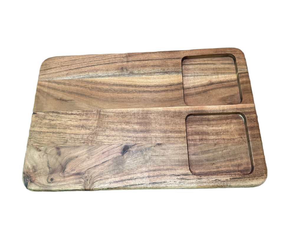 Underside of acacia wood charcuterie board showing bowl cutouts